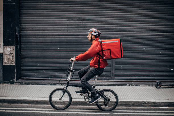 Bicycle delivery man with road bicycle in the city.